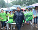 Mangalore: Children brave rains to save the earth