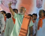 Modi sworn in Gujarat CM, ally JD(U), Opp boycott ceremony