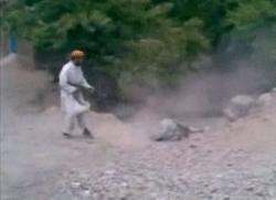 Taliban publicly executes a woman; Karzai orders manhunt