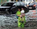 Delhi comes to a halt as downpour floods roads, snaps power, razes walls