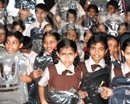 Udupi: Konkani Overseas Returnees Welfare Association Distributes School Bags to Students of Kolalgi