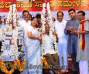 Udupi: District Kannada Sammelan President ceremoniously weighed with books during concluding Ceremo
