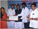 Udupi: Dy CM distributes Manipal Arogya Cards